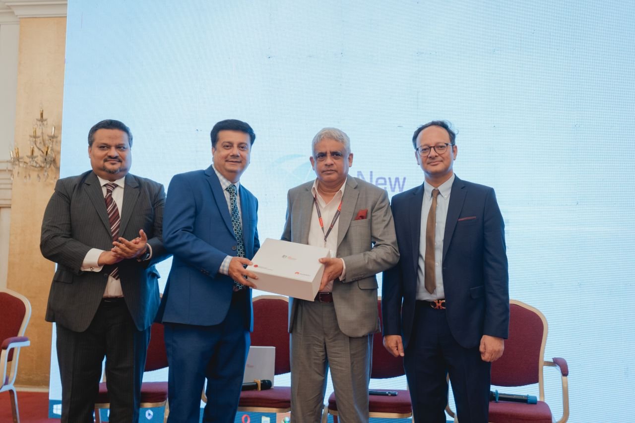 Dr. Imran Batada receiving a memento from the President of IoBM for the launch of myIoBM